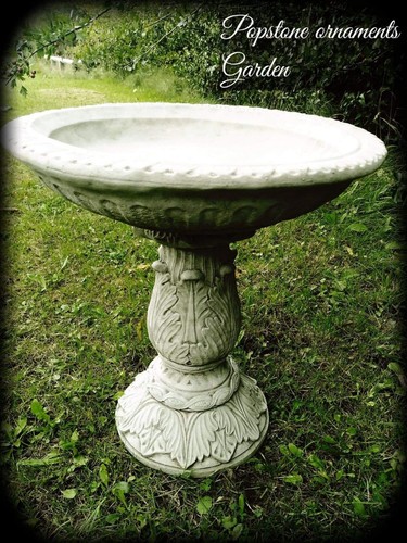 Ornate bird bath feeder hand - bird,